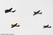 UE08_050 Warbirds formation flyover over New York to mark VE Day. Beech D-18 leading the formation, three T-34A, two SNJ-5, T-28 Trojan and Navion