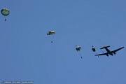 VF05_225 The team’s experienced parachutists, each with a minimum of 35 round canopy, executing a simulated combat jump from the C-46 Commando, “Tinker Belle” in front...