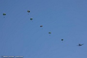 VF05_227 The team’s experienced parachutists, each with a minimum of 35 round canopy, executing a simulated combat jump from the C-46 Commando, “Tinker Belle” in front...