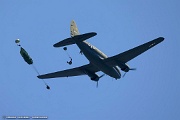 VF05_230 The team’s experienced parachutists, each with a minimum of 35 round canopy, executing a simulated combat jump from the C-46 Commando, “Tinker Belle” in front...