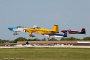 VG27_0150 RV airplanes taking off for large formation flight over Oshkosh grounds