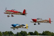 VG27_0155 RV airplanes taking off for large formation flight over Oshkosh grounds