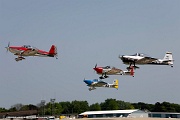 VG27_0156 RV airplanes taking off for large formation flight over Oshkosh grounds