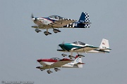 VG27_0162 RV airplanes taking off for large formation flight over Oshkosh grounds